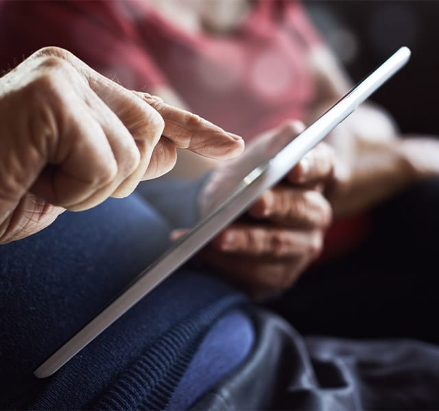 senior on a tablet