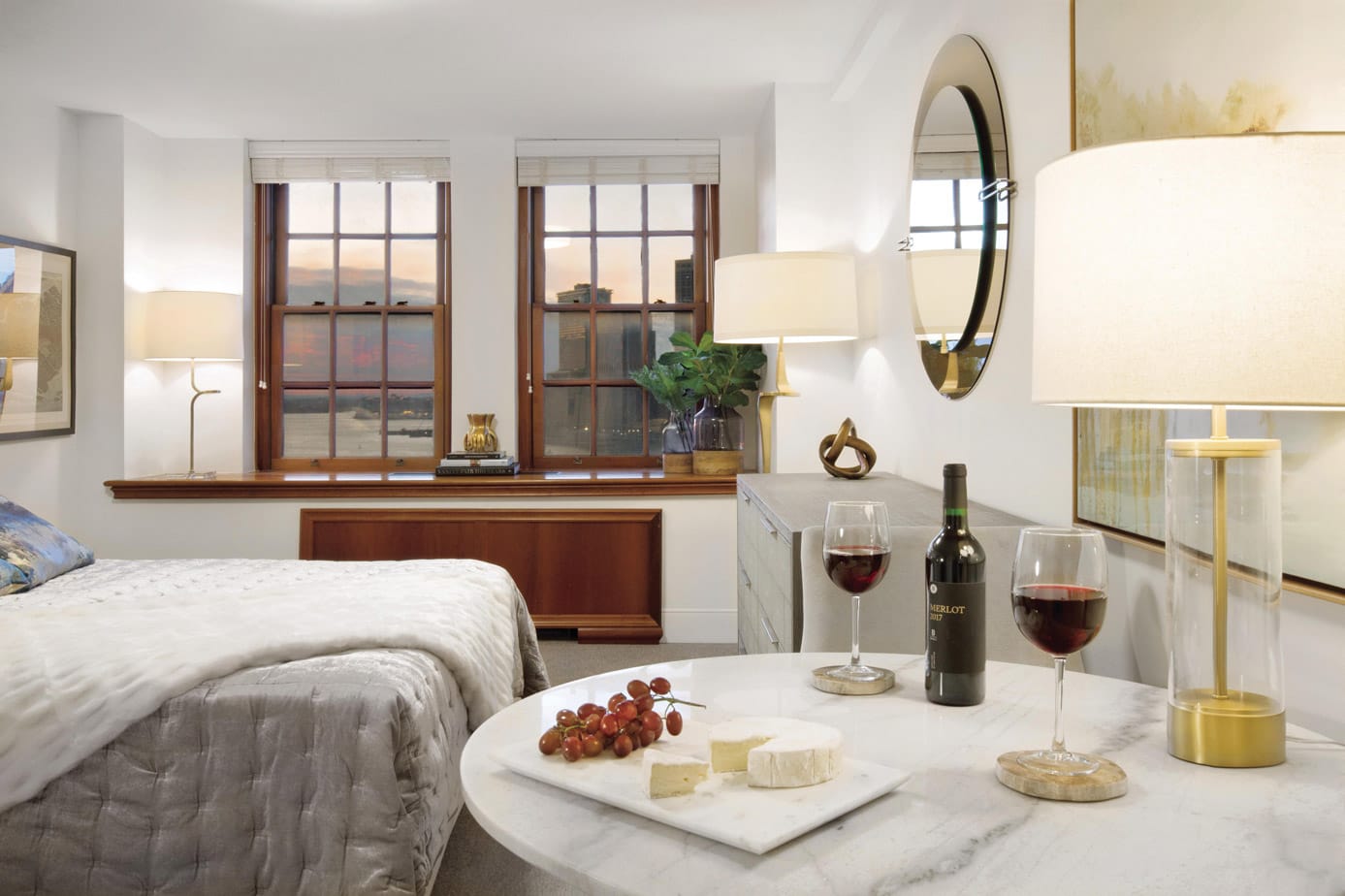 Brooklyn Heights Independent & Assisted Living Photo Gallery - bedroom layout featuring a close up of the a seating area, and a view of New York through the mahogany framed windows