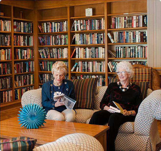 group of elderly woman sitting in a library