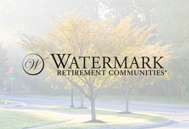 watermark retirement communities lgoo with a tree in the background