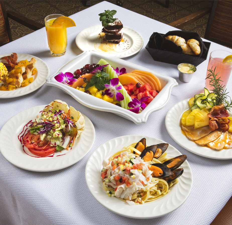 A close up of a table including various dinner dishes 