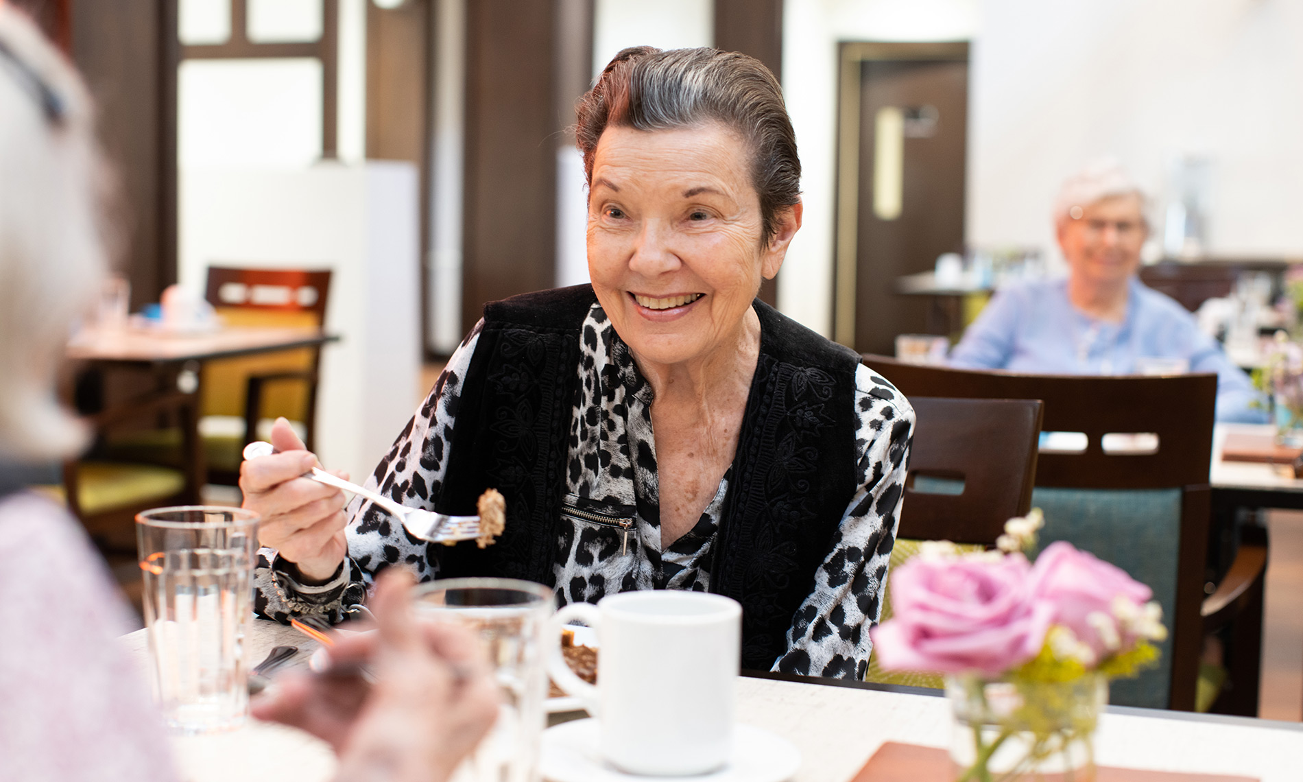two residents enjoying a meal