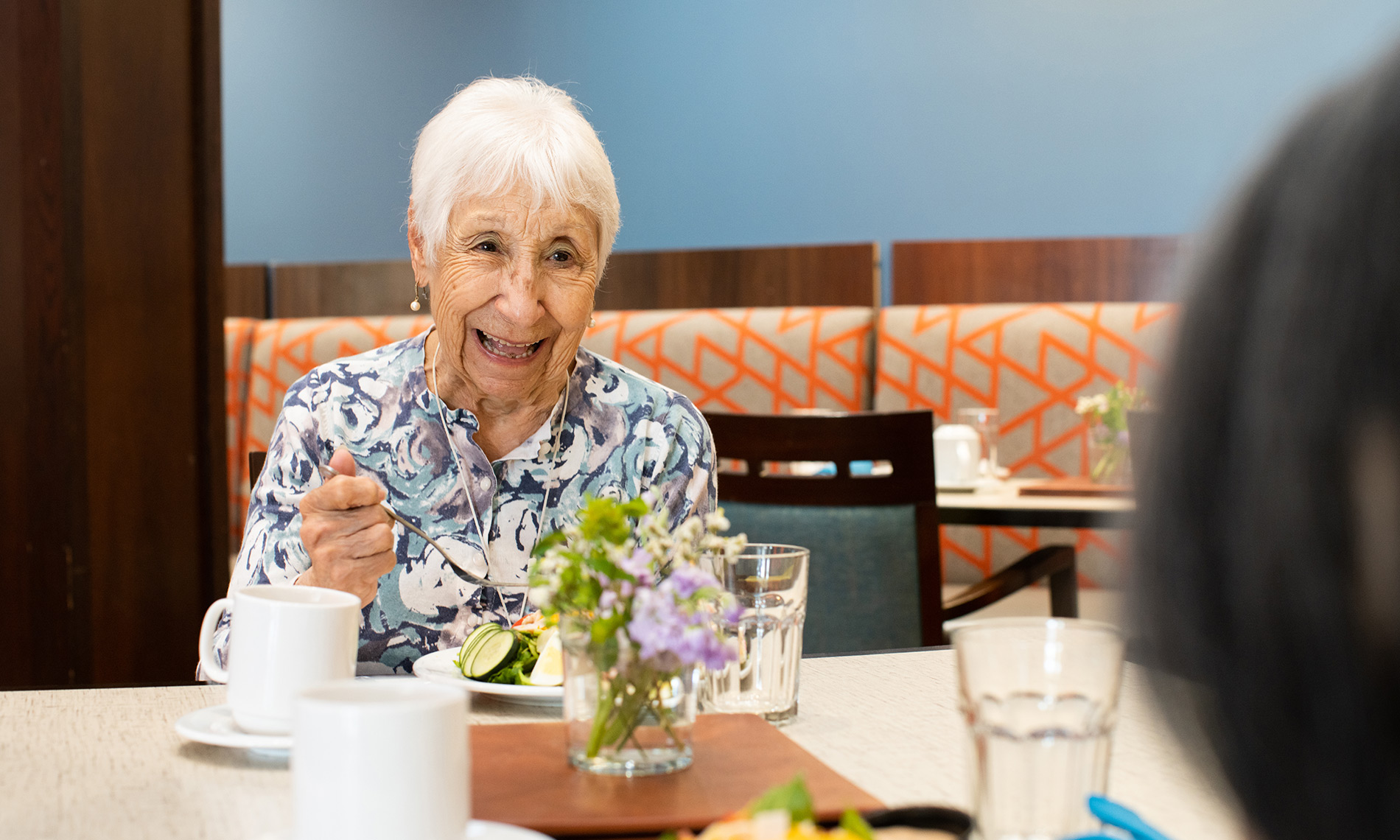 two residents enjoying a meal