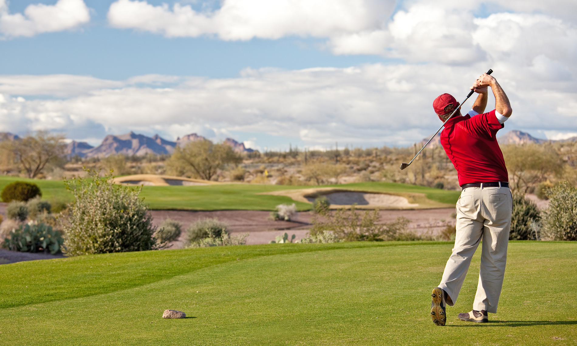 A man playing golf