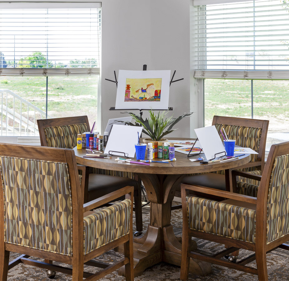 A table with painting tools and canvas ready to be use