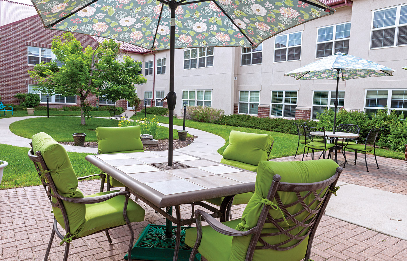 A Patio table, facing the garden area on a bright day