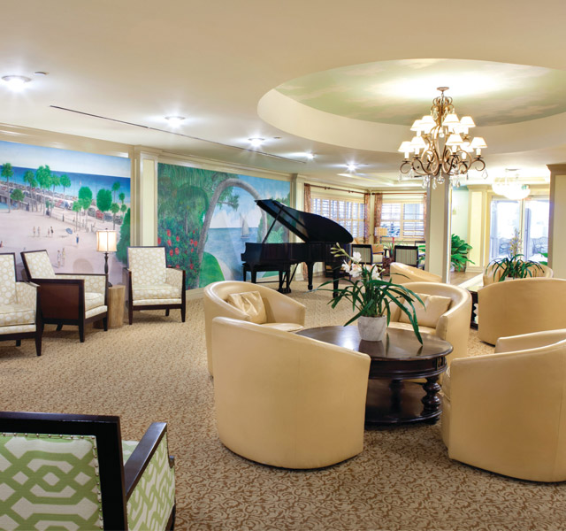 Hall with piano and table arrangement
