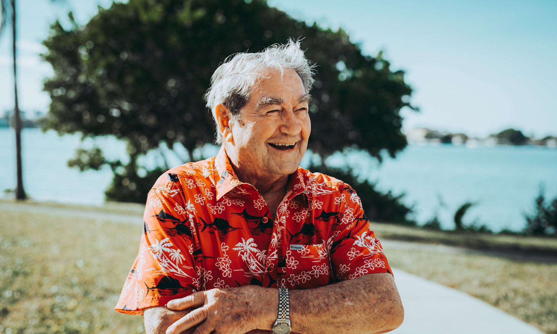 Men resident  outside smiling 