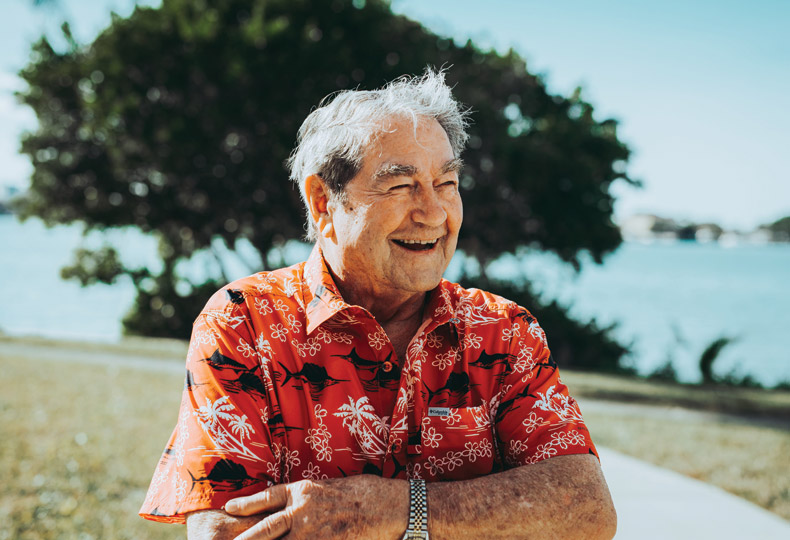 Men resident  outside smiling 