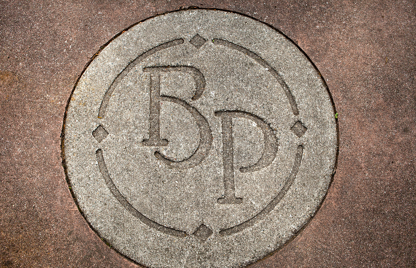 Close up the inlaid initials on the floor