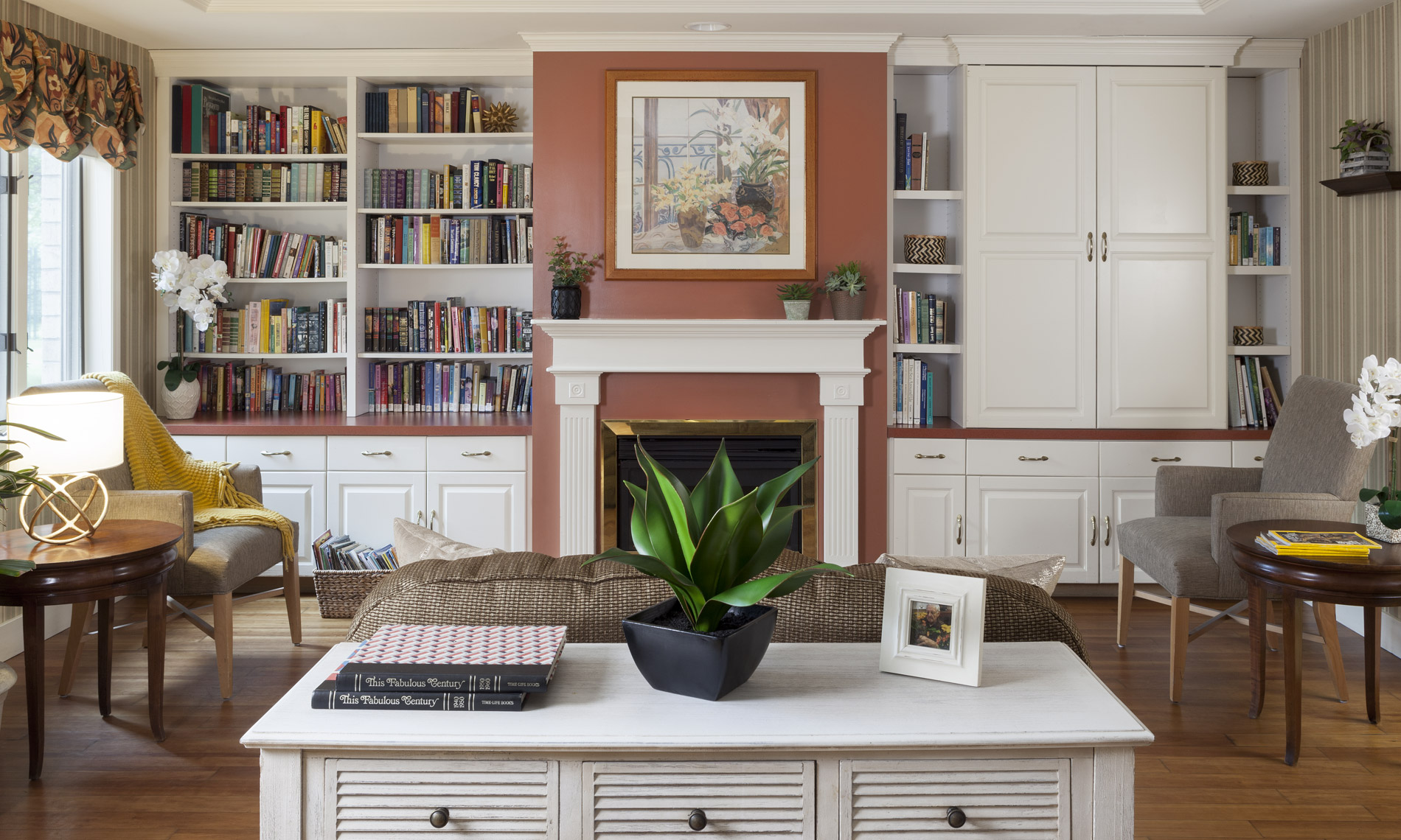 Fireplace with library and painting