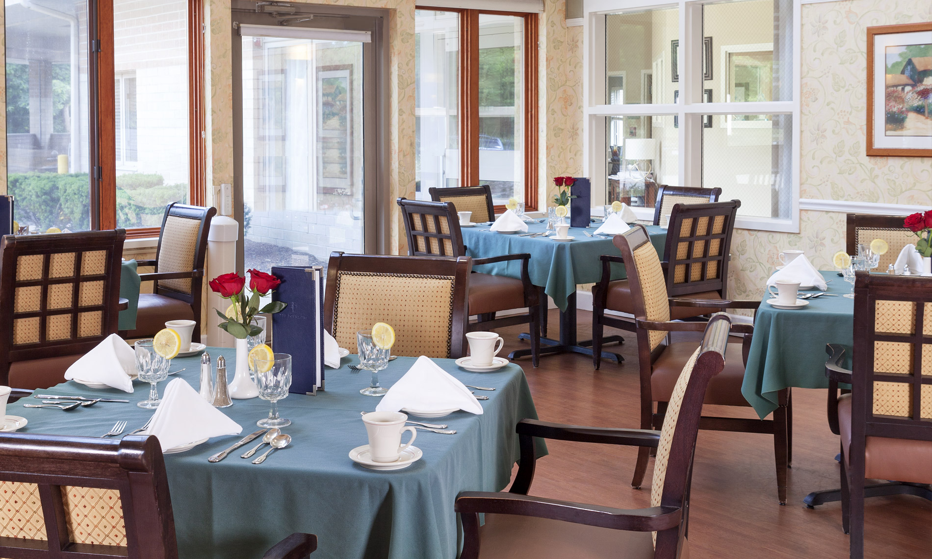 Dining area with multiple table setup with silverwear