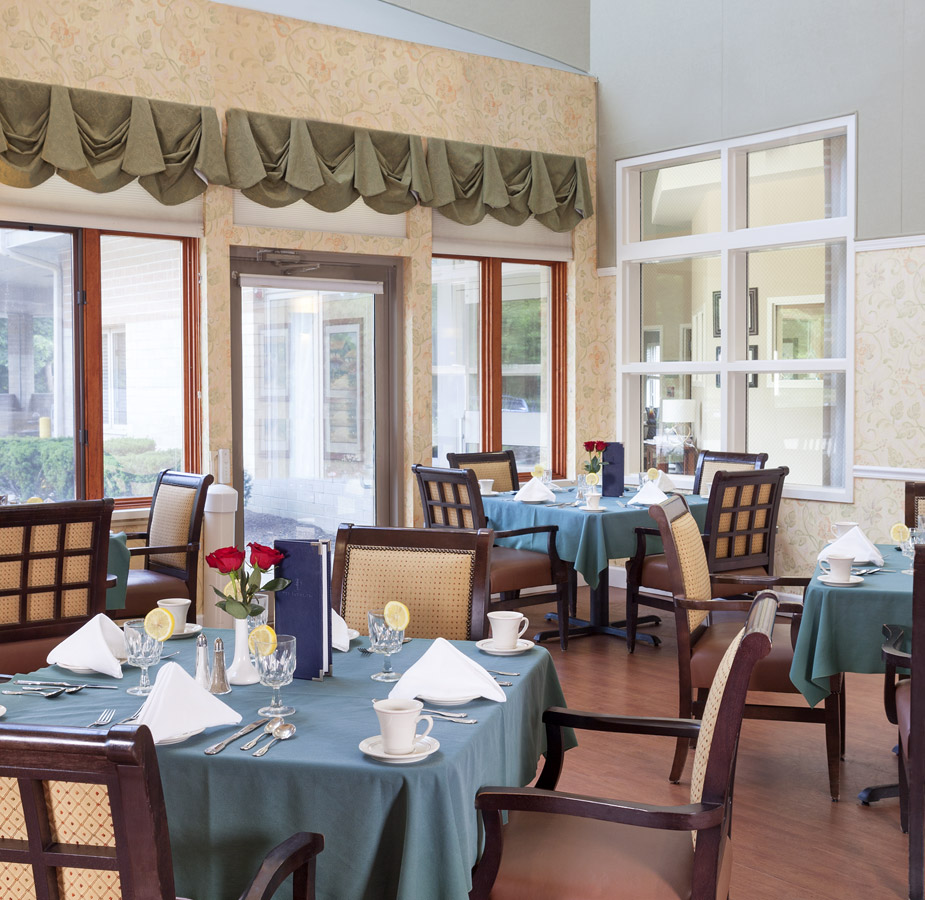 Dining area with multiple table setup with silverware