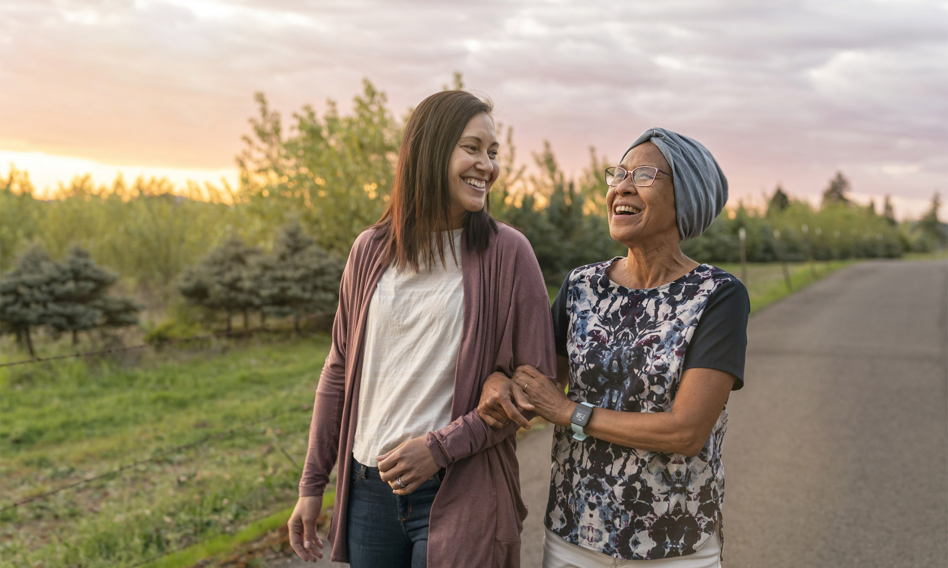 A lady walking with her daughter outside