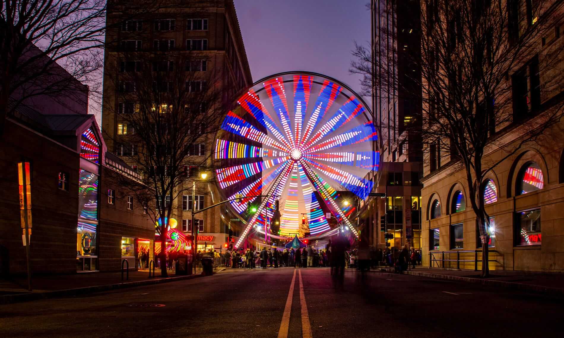 A ferris wheel lit up in downtown Raleigh NC on New Years Eve