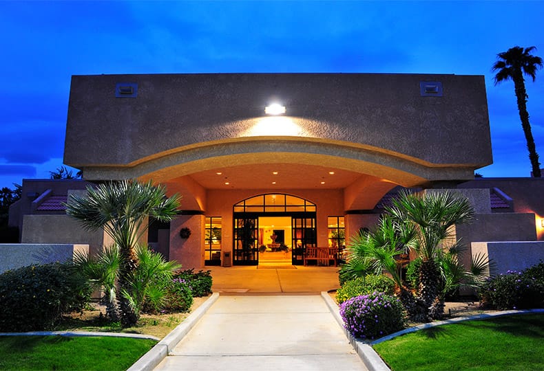 The main entrance to the Fountains at the Carlotta, Emeryville CA after dark
