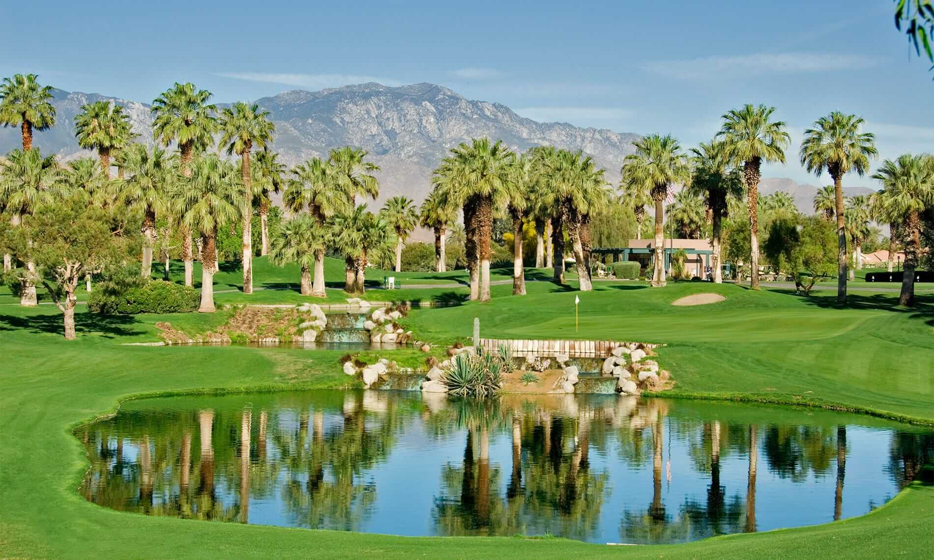 Palm Desert California Resort Golf Course with Palm Trees, Mountains, and Reflections