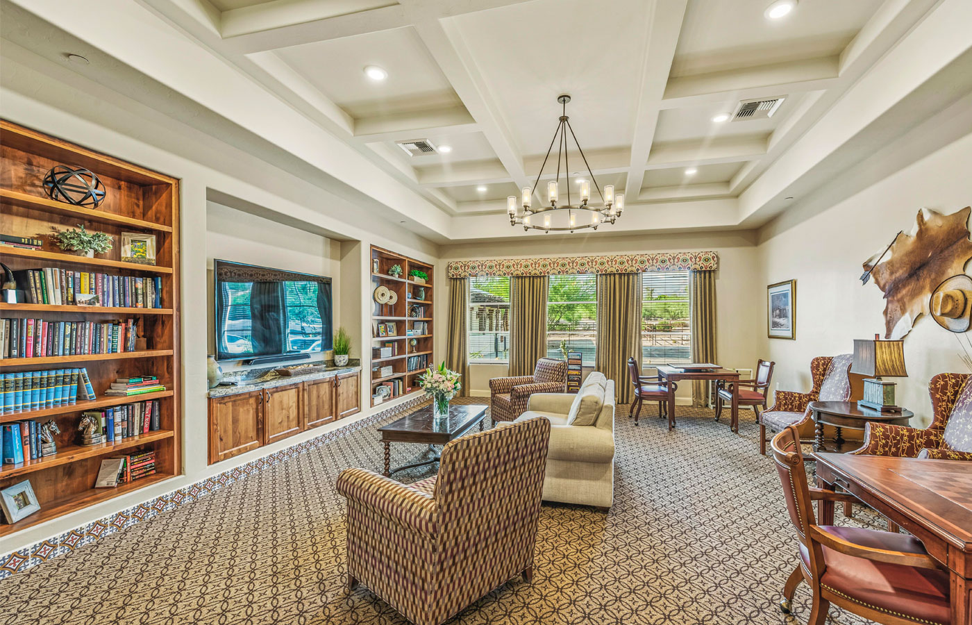 A library filled with a variety of books on-site at The Hacienda at the River