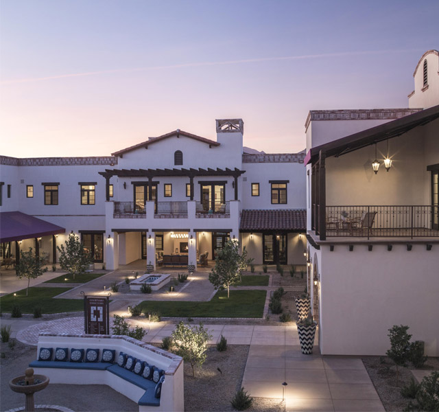 An aerial view of a courtyard at The Hacienda at the Rivers at sunset