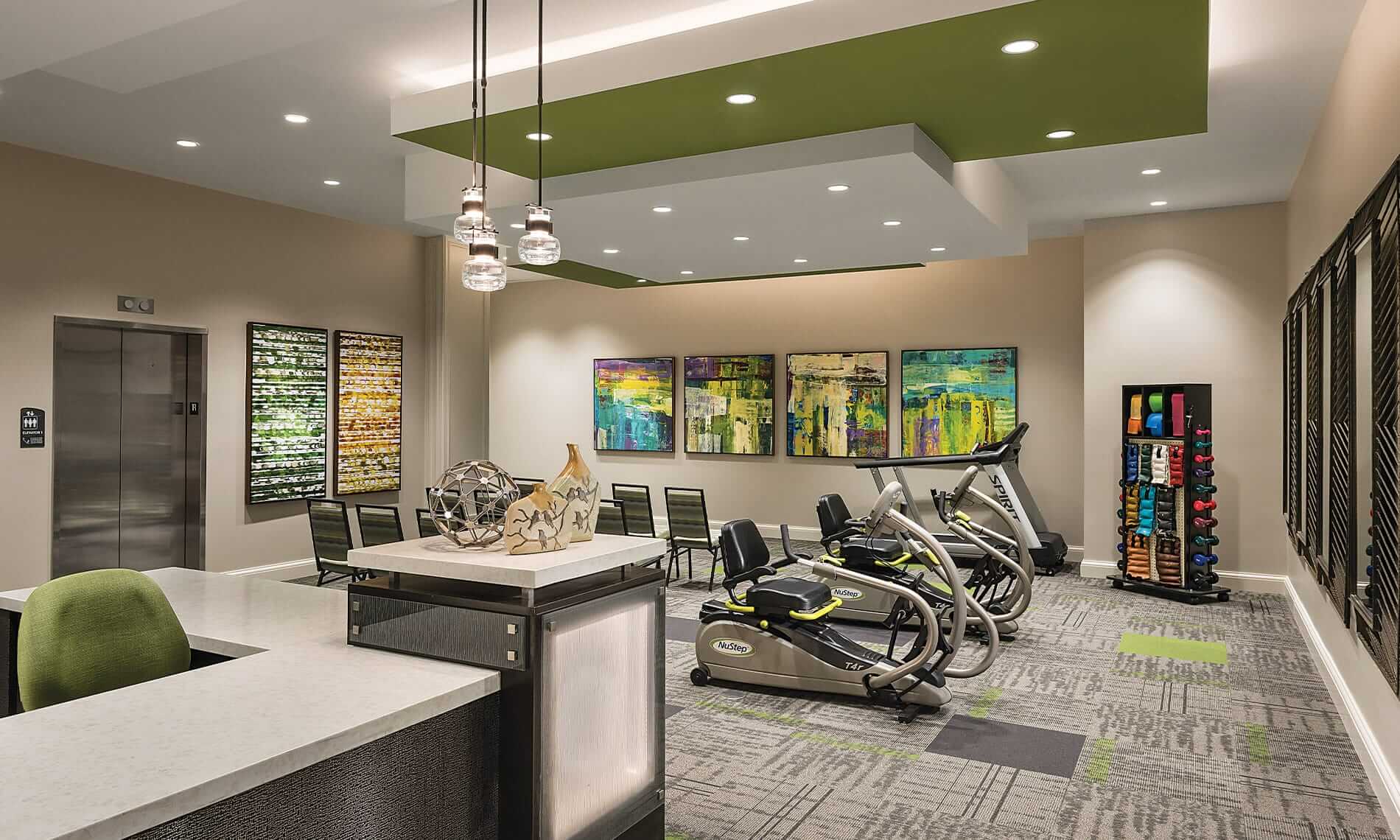 First floor wellness room feature free weights and cardio equipment