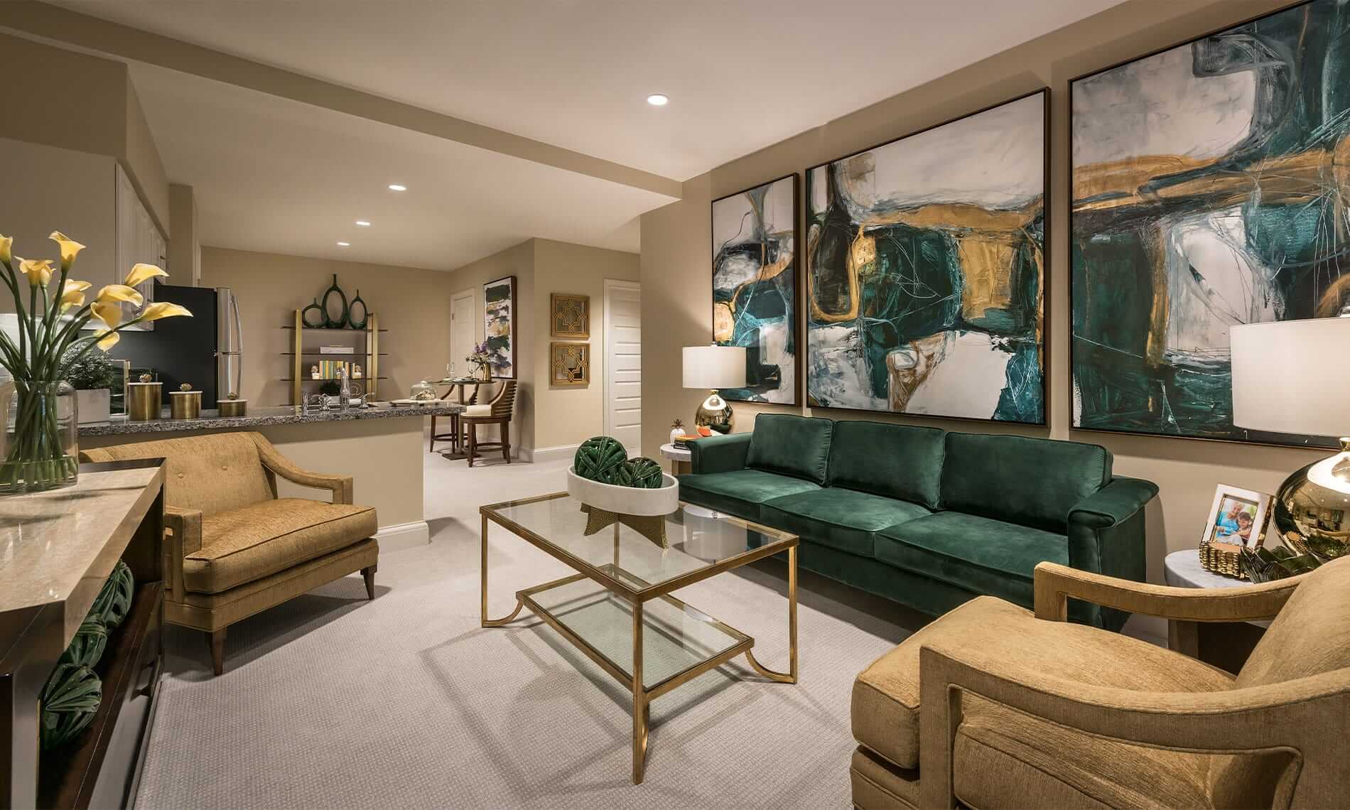 A model unit found at the Preston at the Park Cities featuring green and gold accented furniture