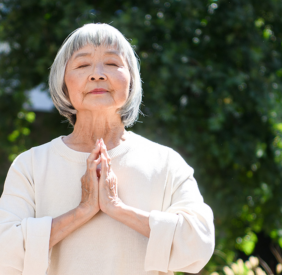 A resident in namaste pose