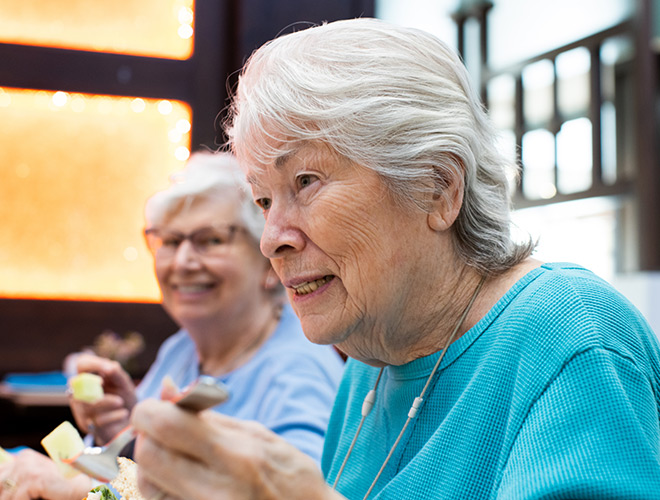 Two residents enjoying a meal