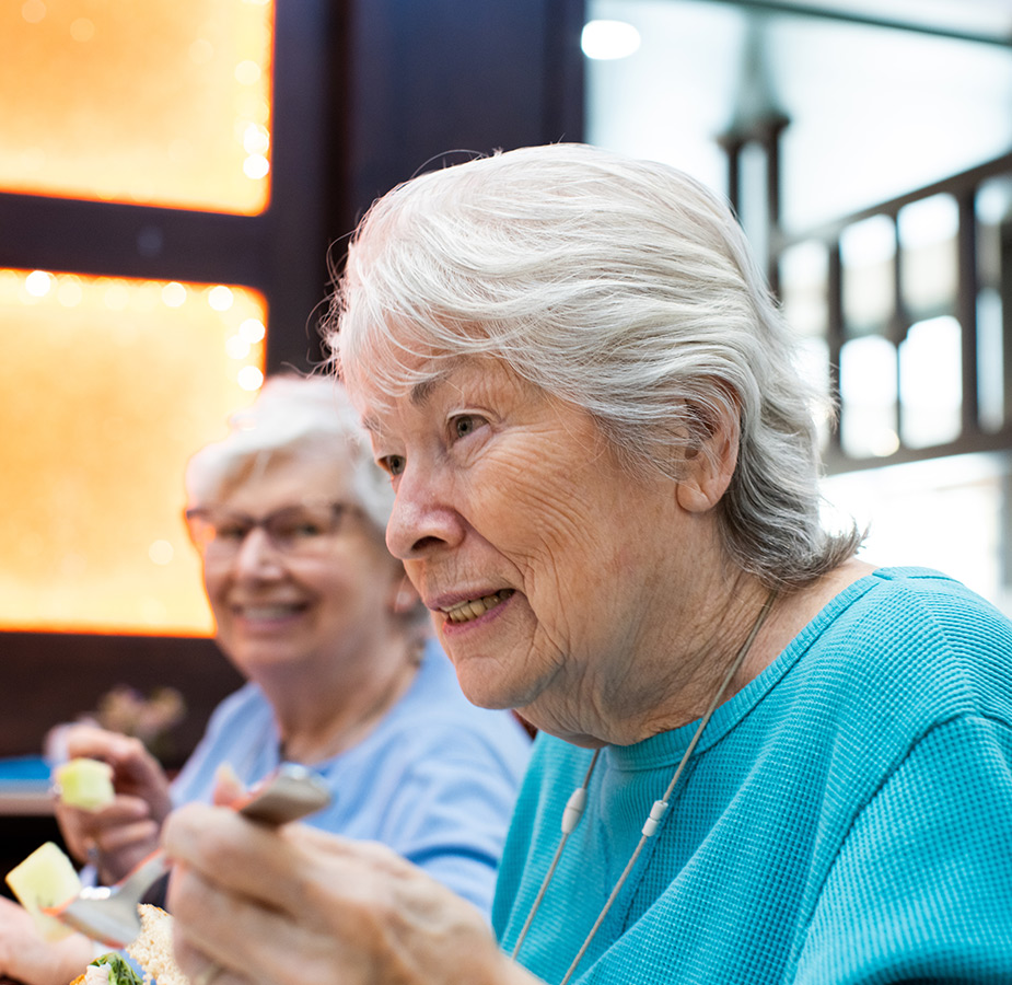 Two residents enjoying a meal
