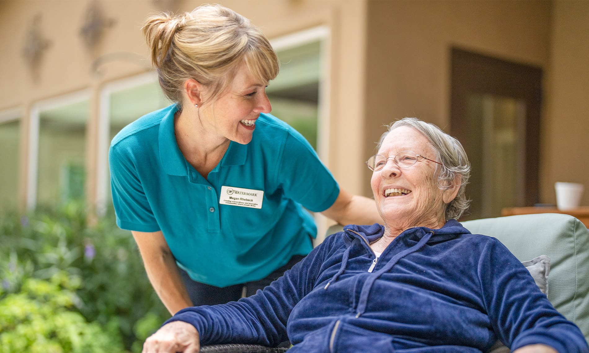 A nurse and a resident at one of the many properties owned by Watermark Retirement Communities across the United States