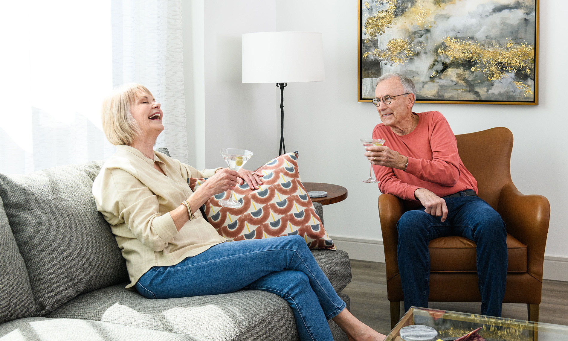 An elderly couple enjoying martinis from the comfort of their private residence at one of our many locations throughout the United States