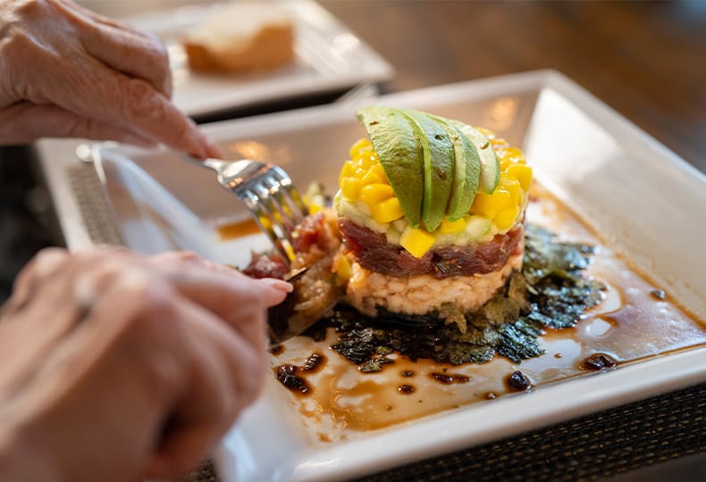 resident eating a chef prepared dish