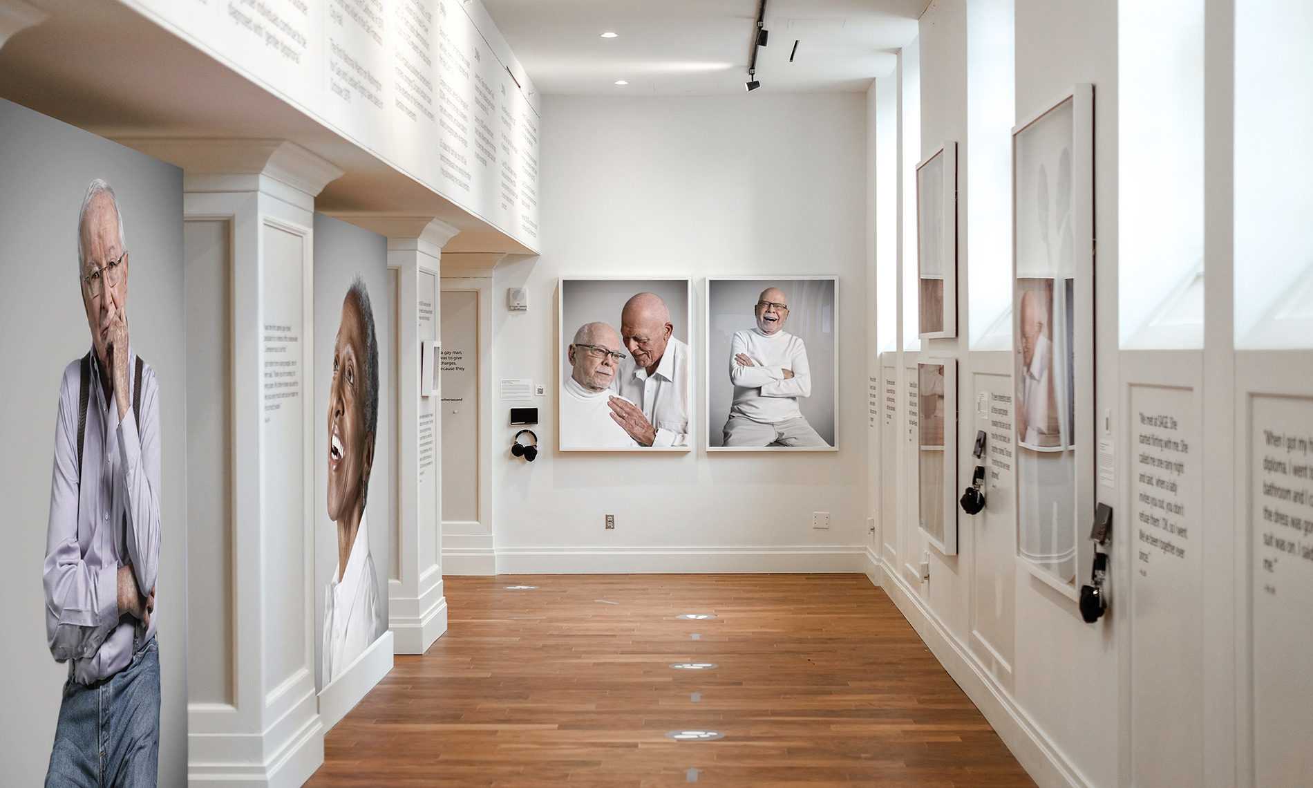 A shot of a Watermark property's lobby from above featuring a woman and her service dog talking a concierge. 