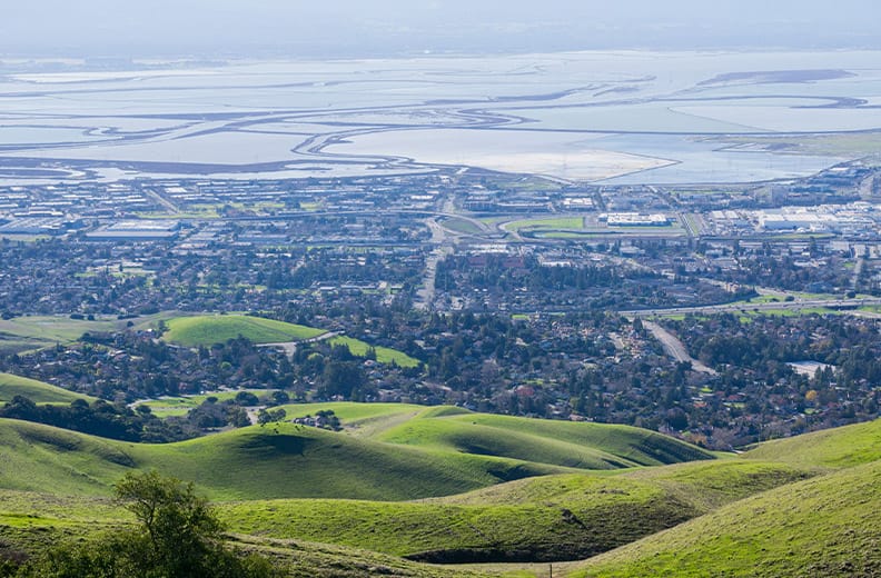 Rolling hills looking towards Fremont, Ca with lakes in the distance