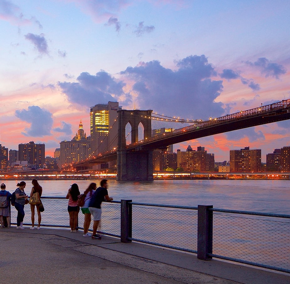 River bridge and town on sunset