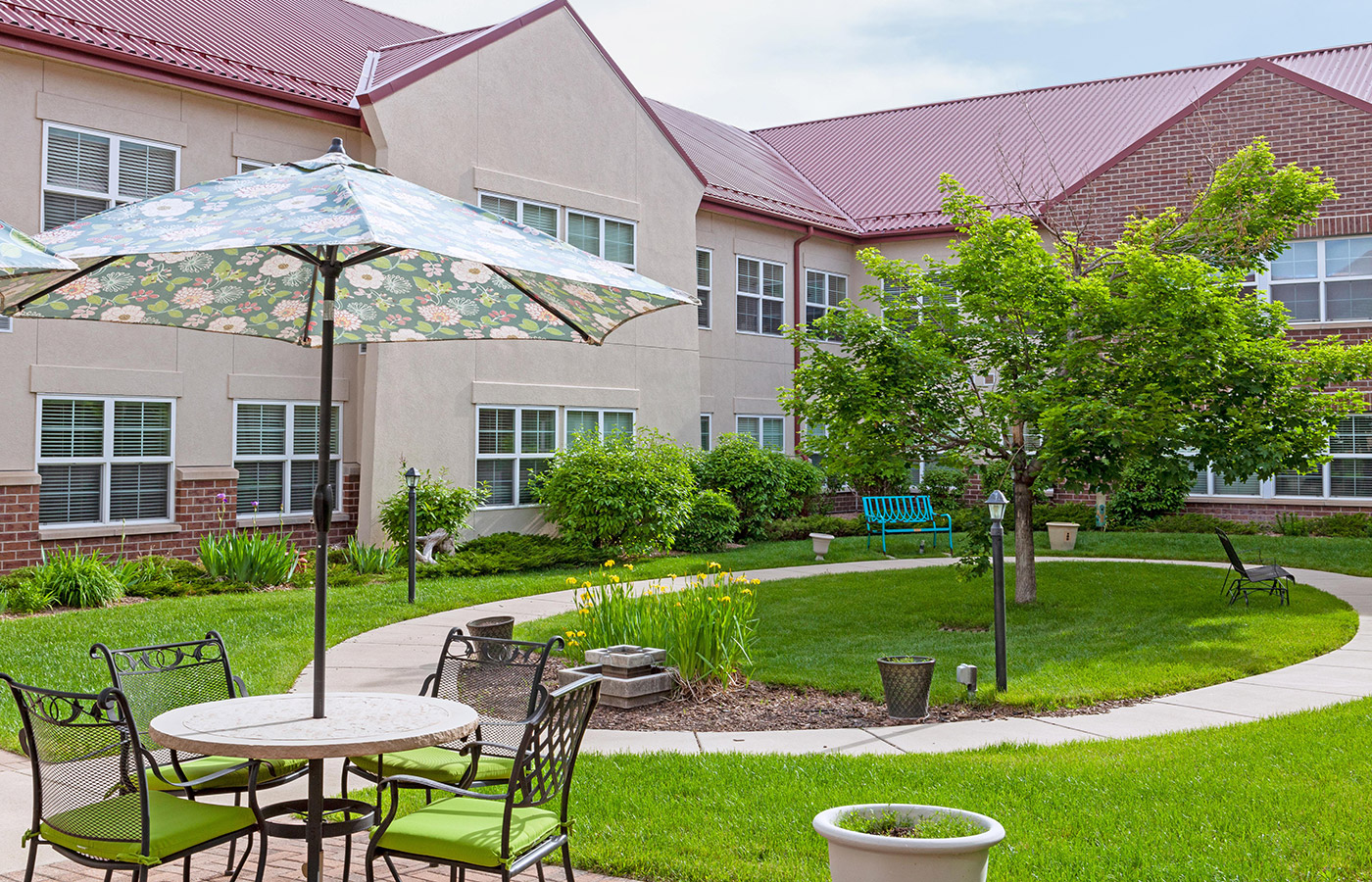 A Patio table, facing the garden area on a bright day