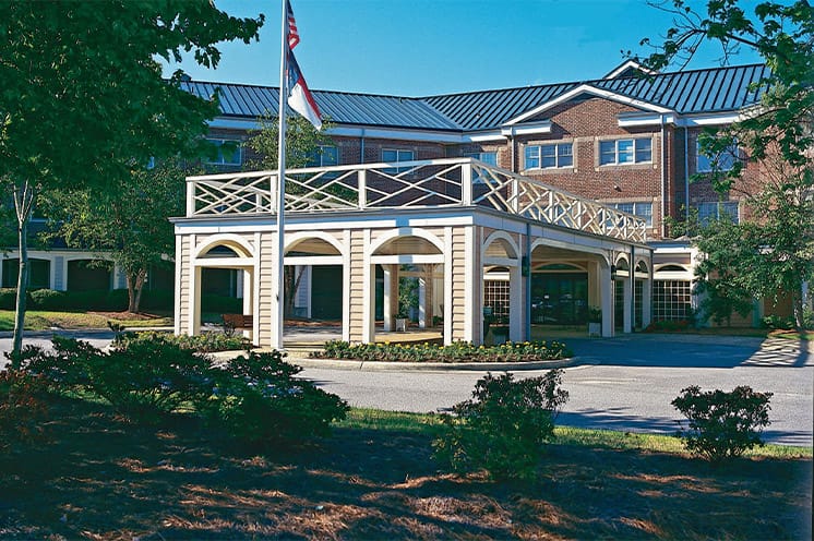 A landscape photo showcasing the main entrance of the Fountains at the Albemarle in Tarboro North Carolina