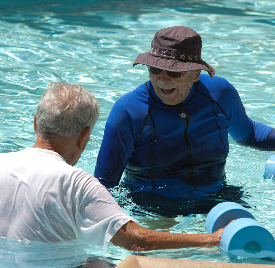 Move A fitness instructor leads a water-aerobics class for a group of elderly women