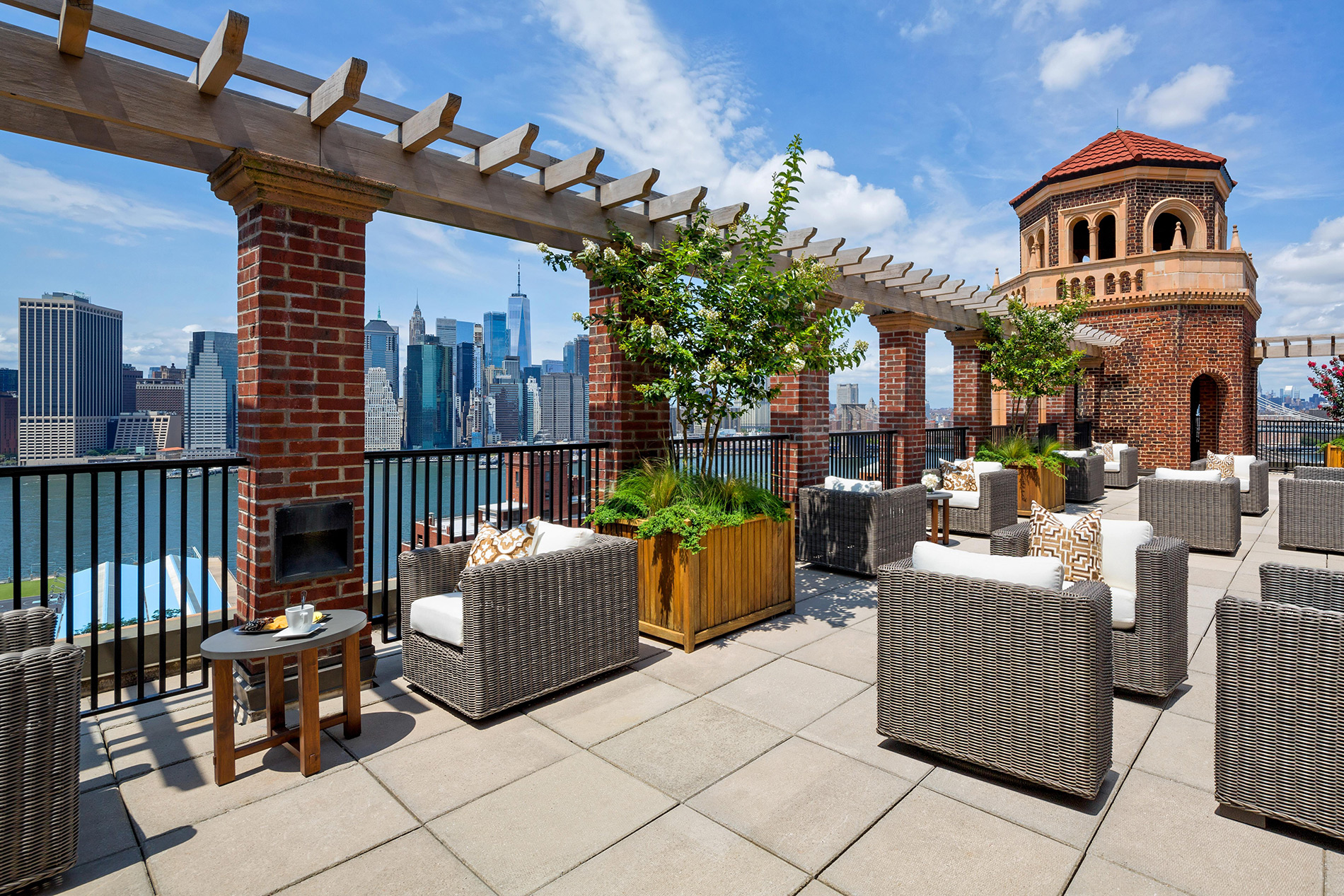 Rooftop terrace with a view of the New York skyline at the Watermark at Brooklyn Heights