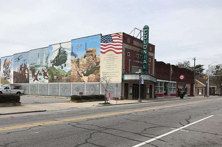 A photo of a building with a mural painted on the side in Tarboro, North Caroline, home of the Fountains at the Albemarle