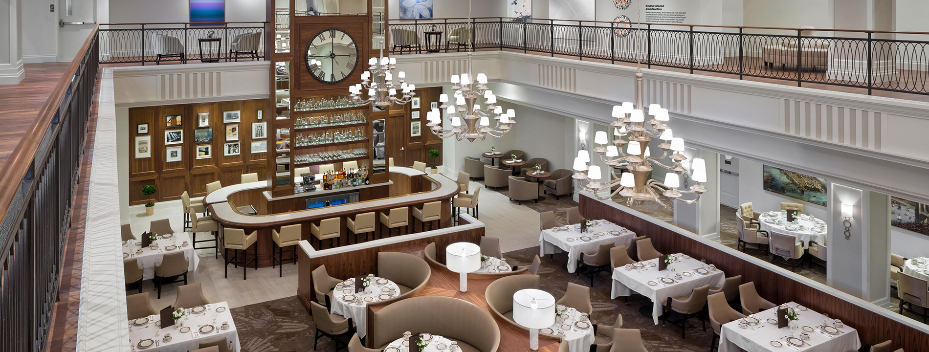 The W Lounge dining room at the Watermark at Brooklyn Heights seen from an open terrace above