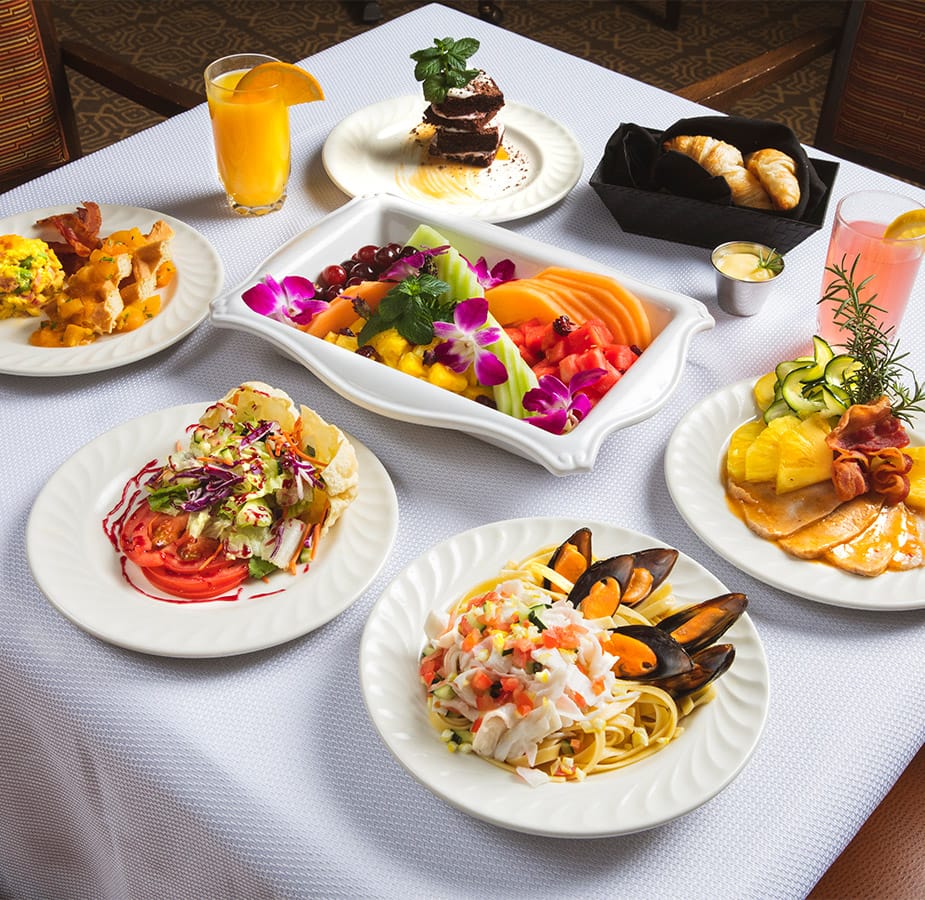 an assortment of food on a white table cloth