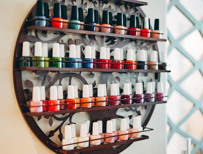 The Fountains at the Albemarle Indulge Salon & Spa A shelf lined with nail polish in a variety of vibrant colors