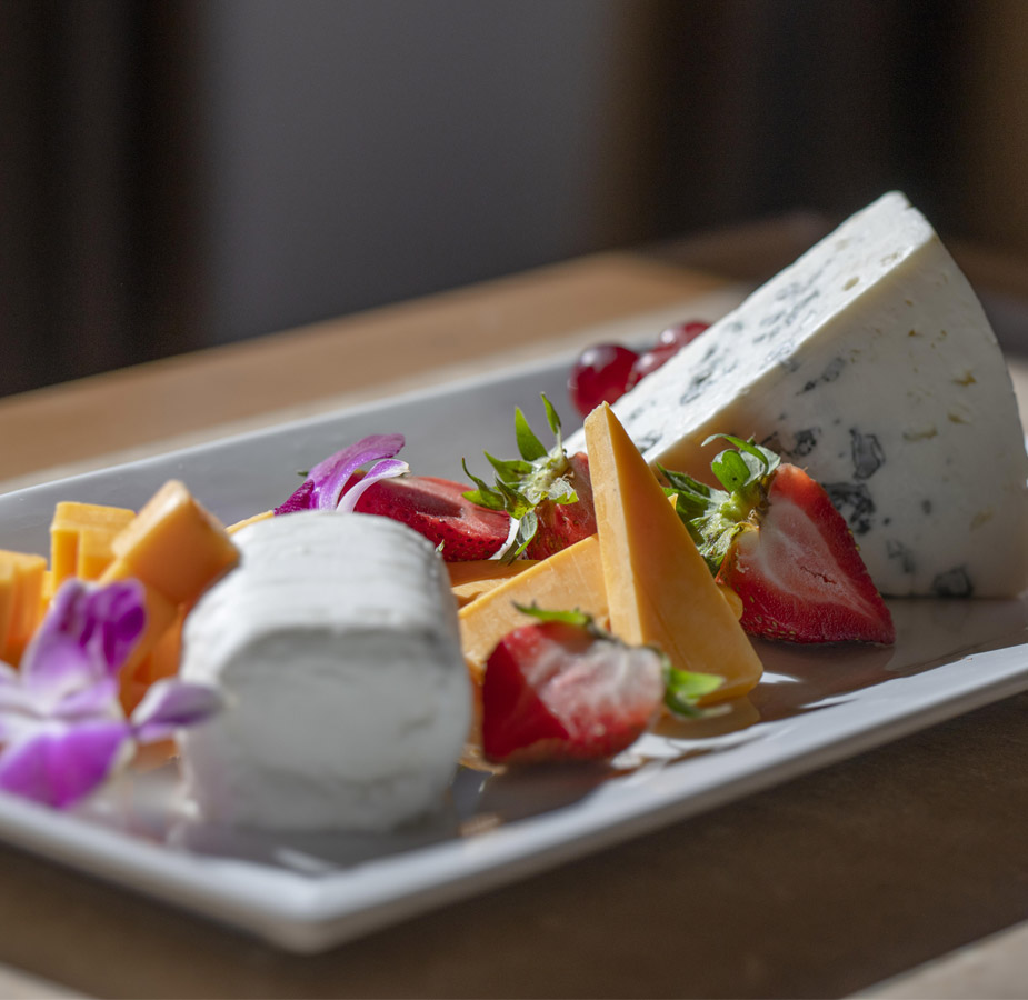 The Hacienda at the River Dining A cheese and fruit plate prepared by the an on-site chef
