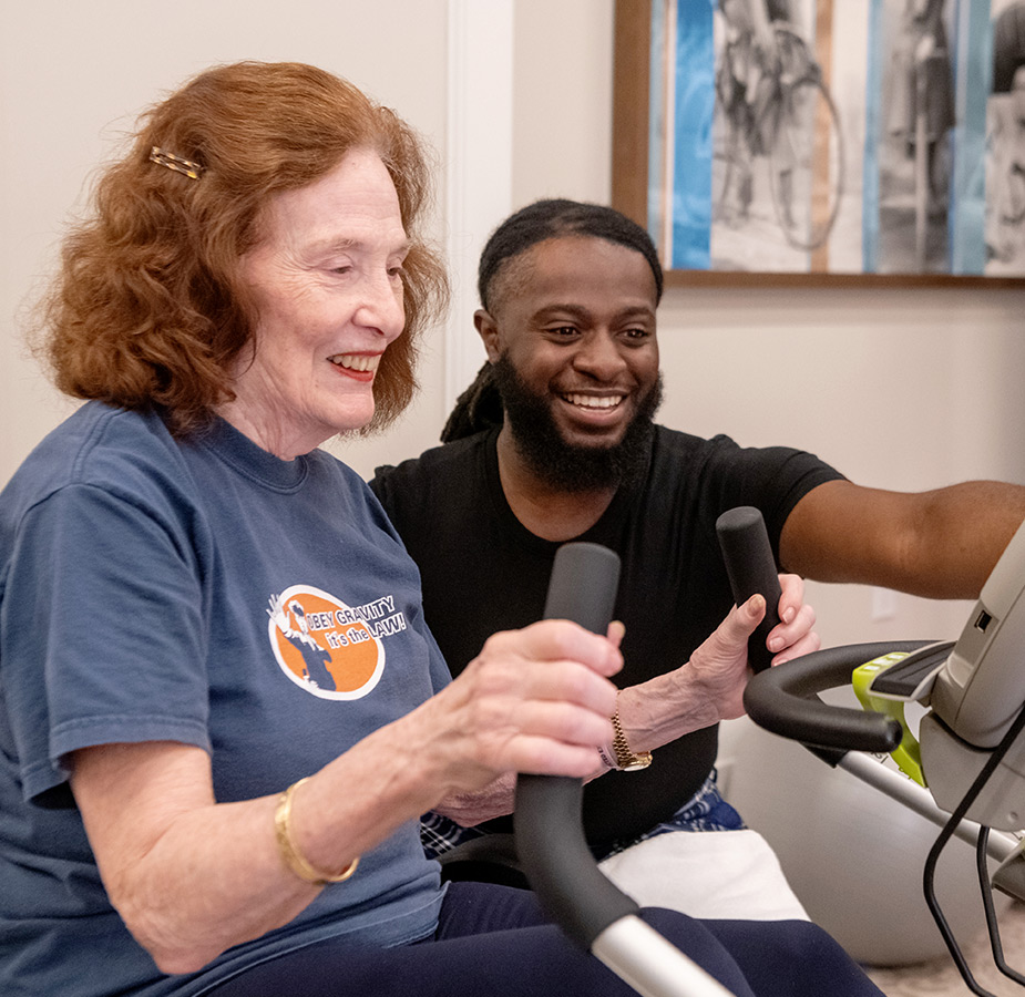 Fitness Trainer orienting resident on fitness practice.
