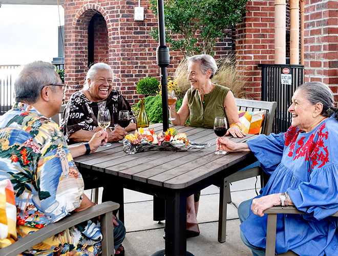 Residents enjoying a snack on an outdoor patio