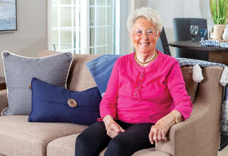 independent living carousel An elderly woman sitting on a cozy couch looking health and full of light