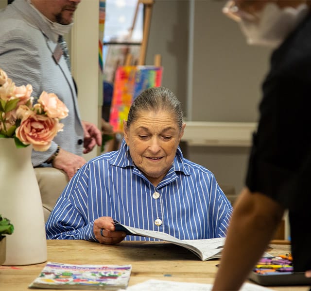 elderly woman reading a book elderly woman reading a book