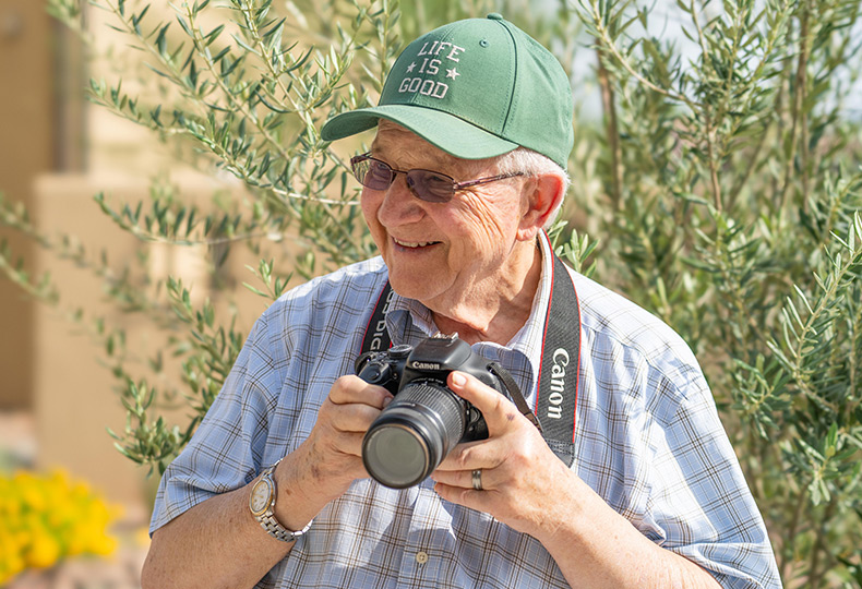 An old man with a camera