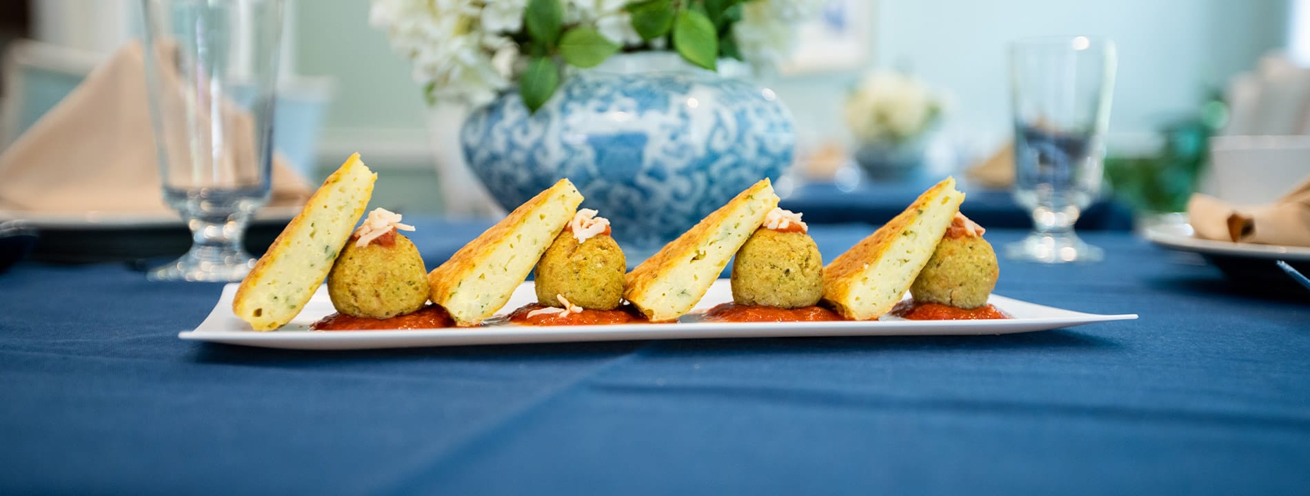 plated dish set on a table with blue table cloth