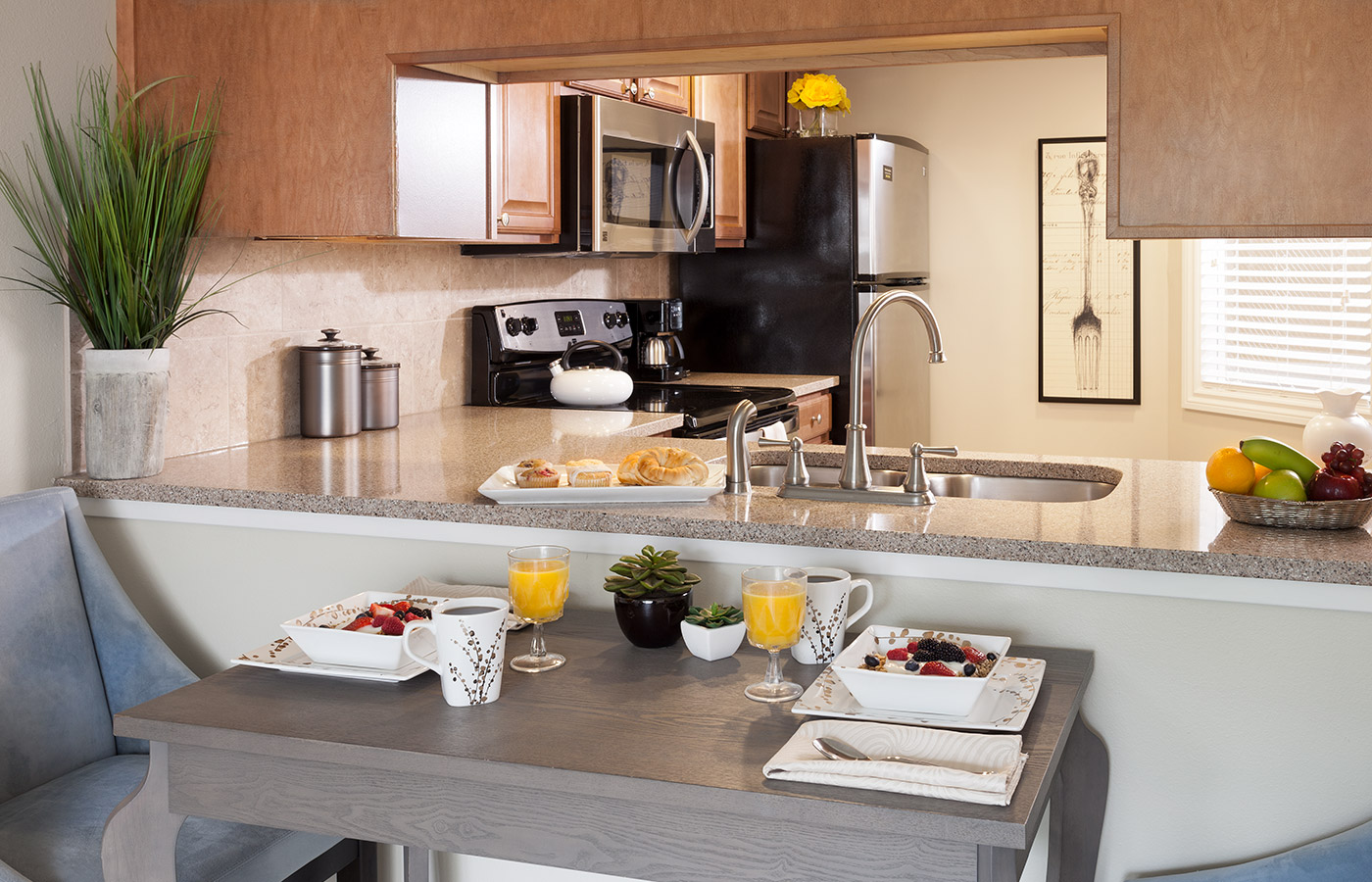 Kitchen Kitchen area of the apartment with breakfast on table